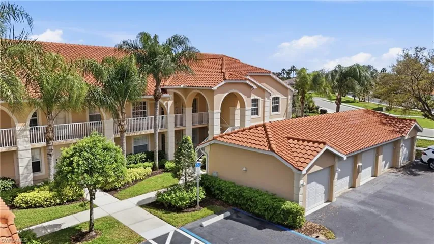 Warm and welcoming exterior with lush landscaping and a beautifully maintained entry.