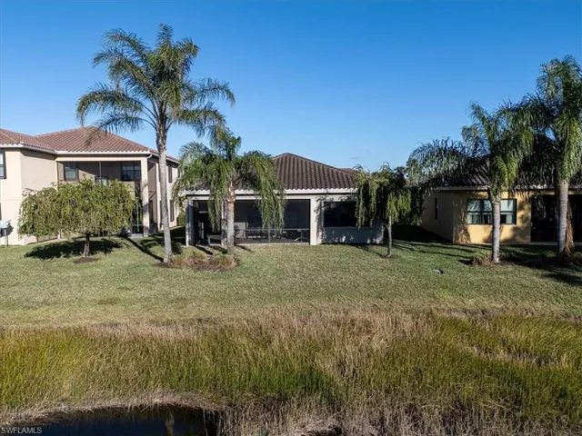 View of yard with a sunroom