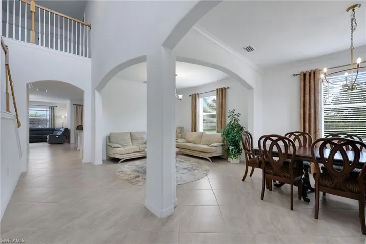 formal dining and sitting areas opens to kitchen and family rooms