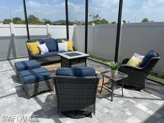 View of patio / terrace featuring an outdoor living space with a fire pit