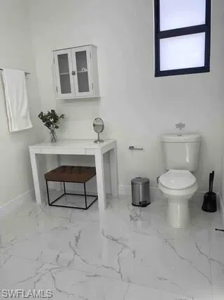 Bathroom with marble finish flooring