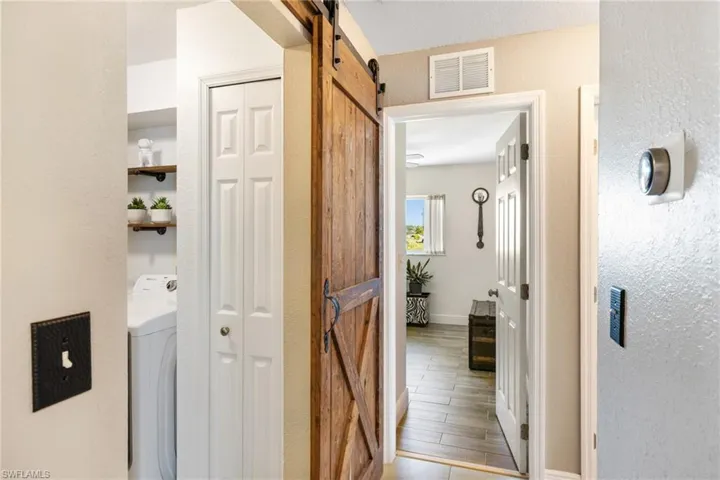 Hallway with laundry on left, office straight ahead