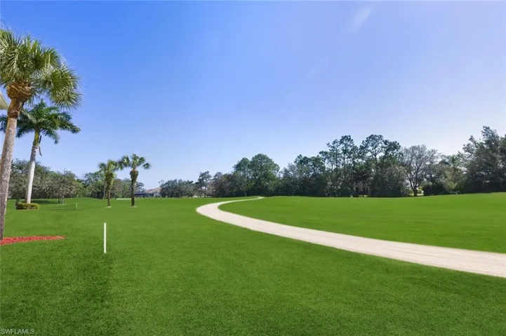 View of community featuring view of wooded area