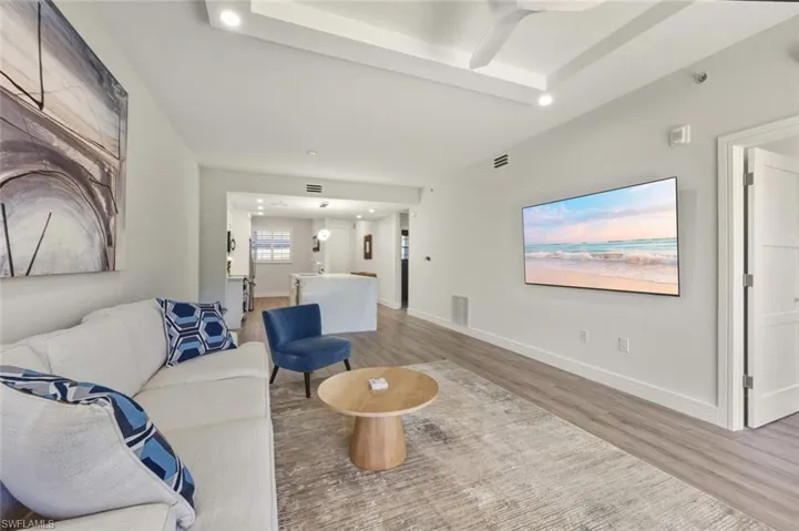 Living room with ceiling fan, and recessed lighting