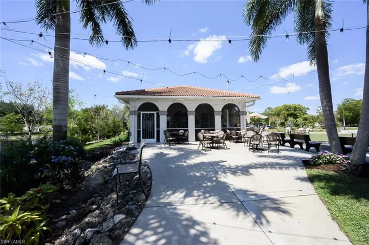 View of home's community featuring a patio and outdoor dining space
