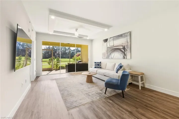 Living room with wood finished floors and baseboards