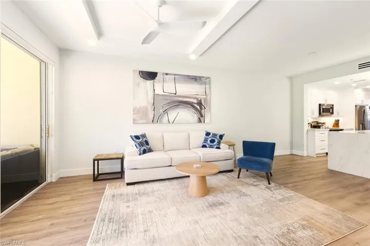 Living area with ceiling fan and recessed lighting