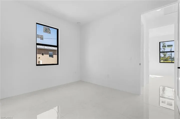Unfurnished room with baseboards