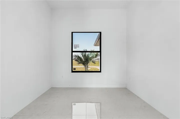 Unfurnished room featuring baseboards