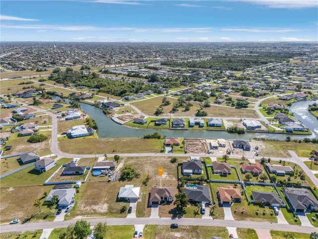 Birds eye view of property featuring a residential view and a water view
