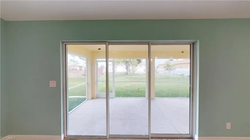 Doorway featuring plenty of natural light