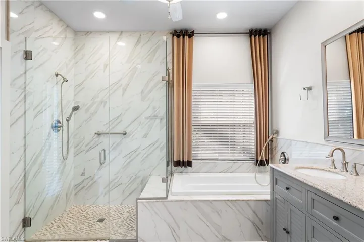 Escape to your primary ensuite bath oasis after a long day on the Links and relax in your soaking tub! Floor to ceiling tile in the walk in shower boasting seamless shower enclosure!