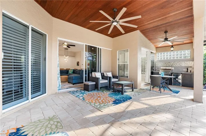 Tongue and groove ceiling on the lanai. Large covered space which includes a full outdoor kitchen! Pavered lanai and pool deck.