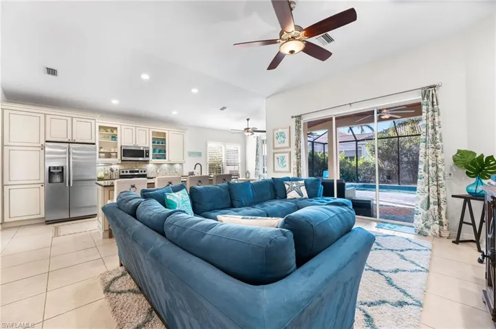Open concept with this remodel. Custom cabinetry. Tile floors. 8 ft sliders.