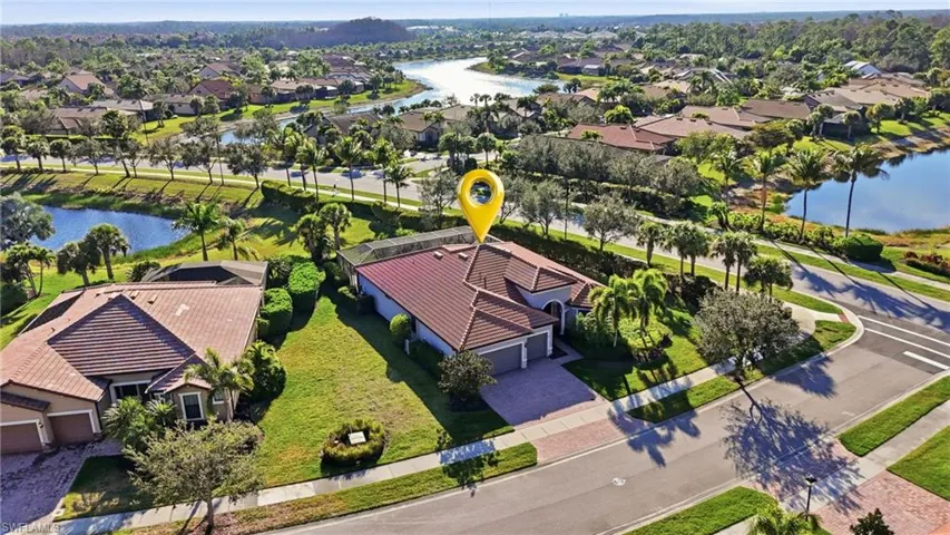 Aerial view of residential area with a large body of water