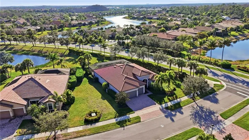 Aerial perspective of suburban area with a large body of water