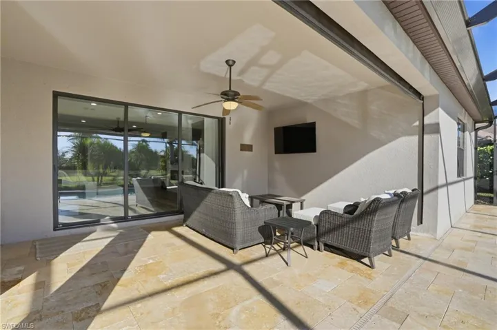 View of patio featuring a ceiling fan and an outdoor lounge area