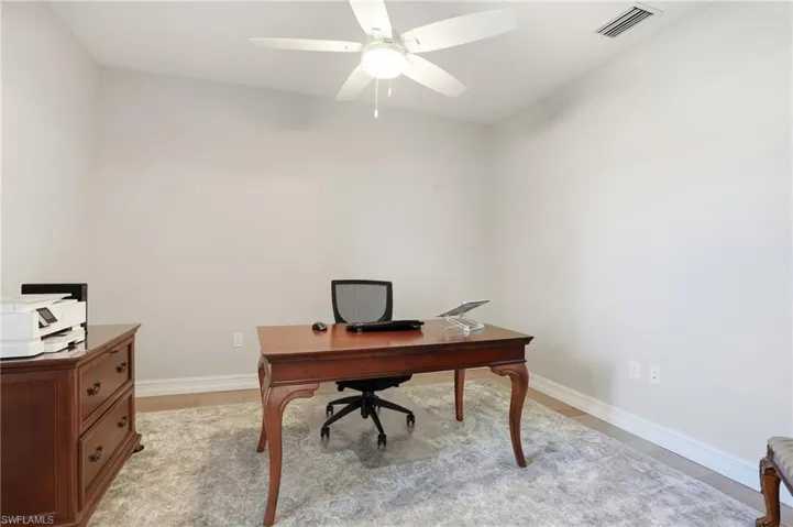 Office featuring light wood-style flooring and a ceiling fan