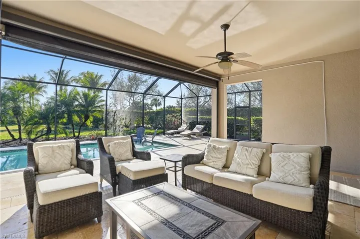 View of patio / terrace with an outdoor hangout area, an outdoor pool, a sunroom, ceiling fan, and cage enclosure
