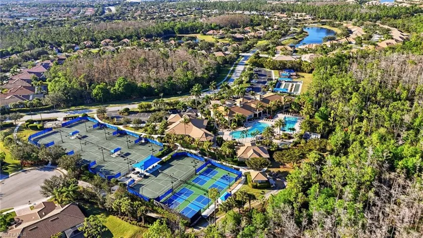 Aerial view of residential area featuring a large body of water