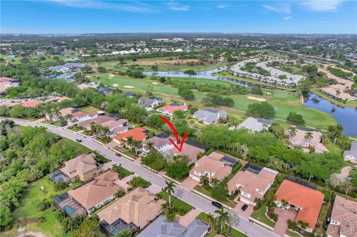 Aerial view with a residential view, golf course view, and a water view