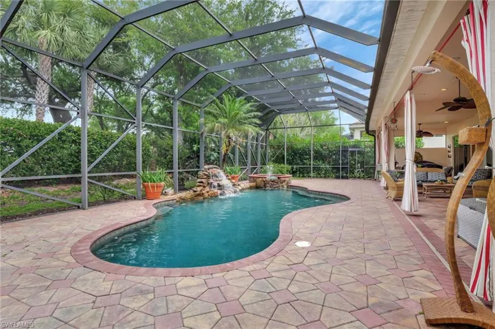 Pool featuring ceiling fan and a patio area