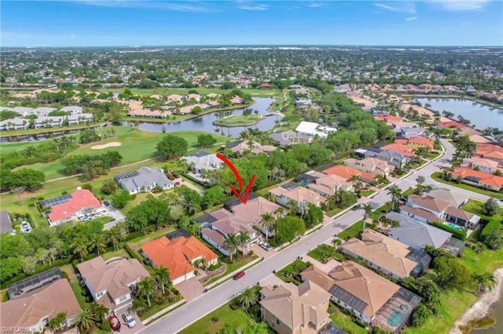 Birds eye view of property featuring a residential view, golf course view, and a water view
