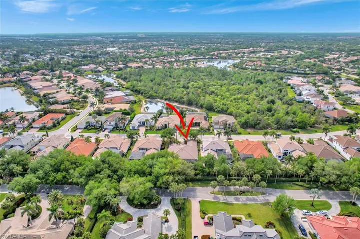 Drone / aerial view with a residential view and a water view