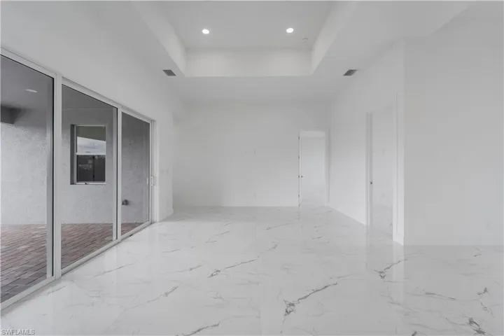 Hall featuring marble finish floor, visible vents, and baseboards