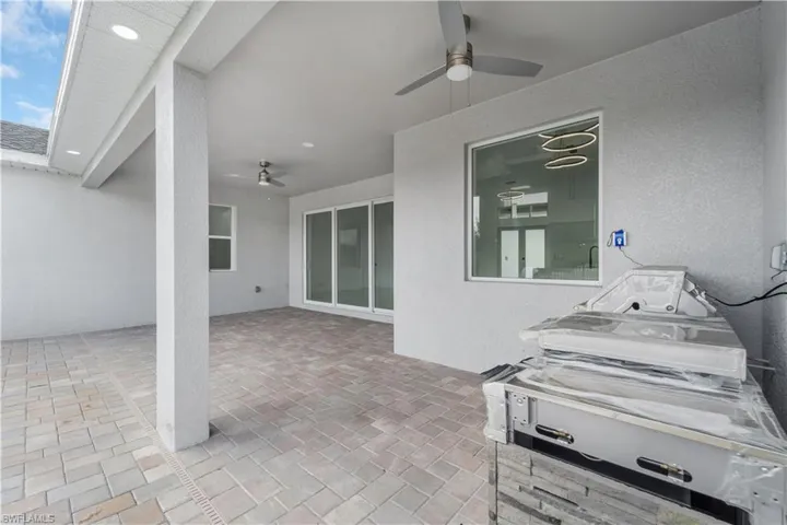 View of patio with a ceiling fan