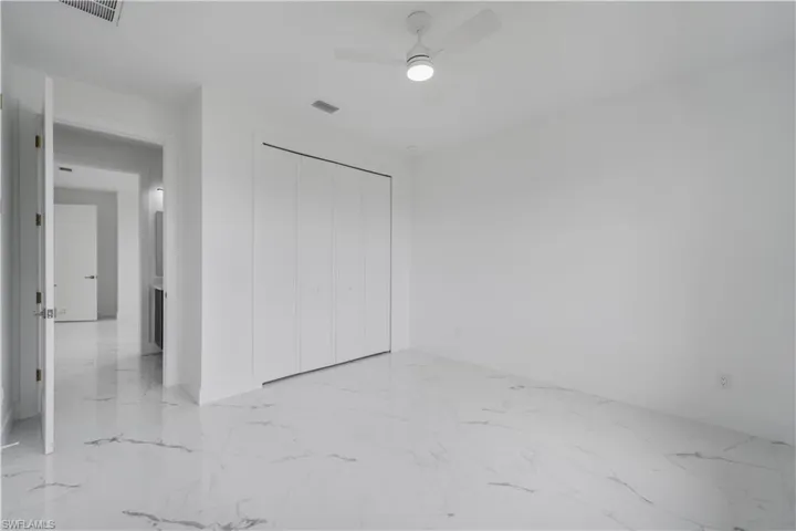 Spare room featuring baseboards