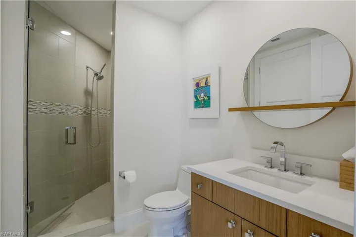 Full bathroom, with upgraded cabinetry andquartz countertops - with access from guestbedroom and den/office.