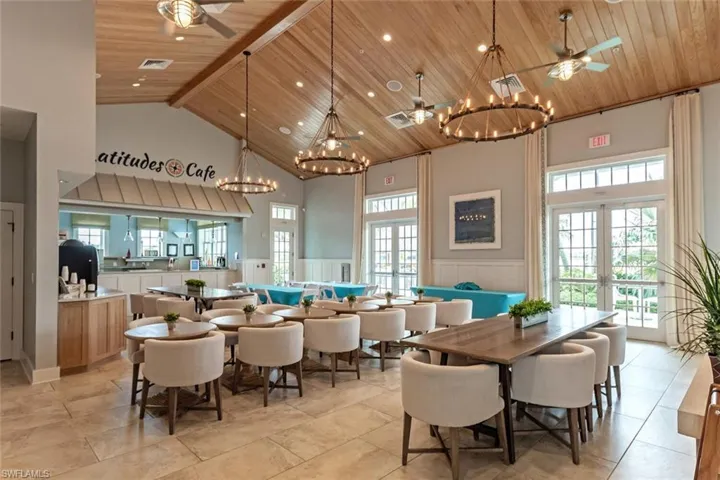 Dining room with wooden ceiling, french doors, and high vaulted ceiling