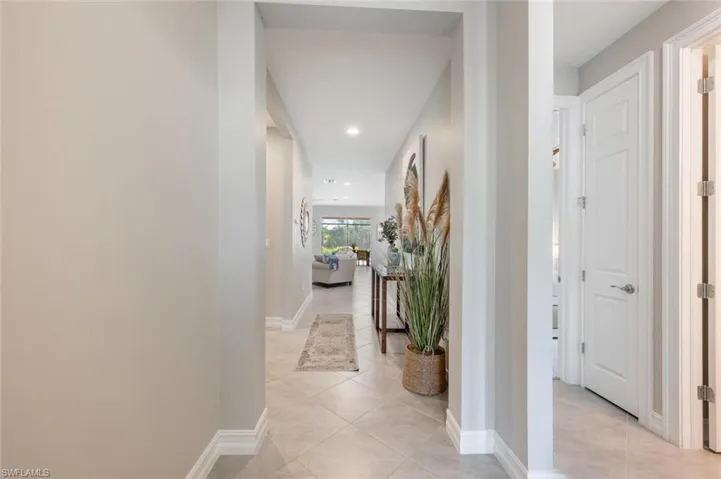 Hallway with light tile patterned floors
