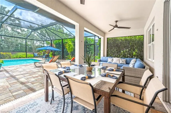 View of patio / terrace featuring outdoor lounge area, ceiling fan, and a lanai