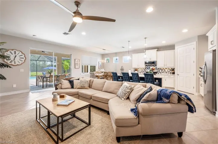 Tiled living room with ceiling fan