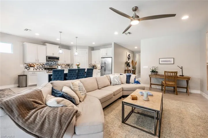 Living room featuring ceiling fan
