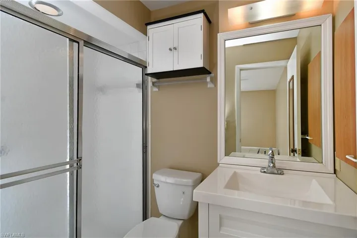 Master Bath with walk-in shower. new toilet and vanity