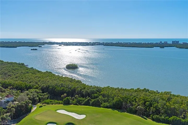 Bird's eye view of a golf club and a nearby body of water