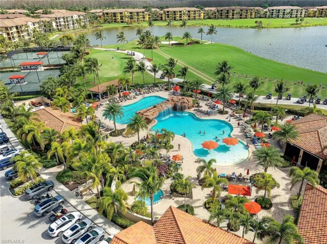 Expansive resort-style pool with rock features and water cascade