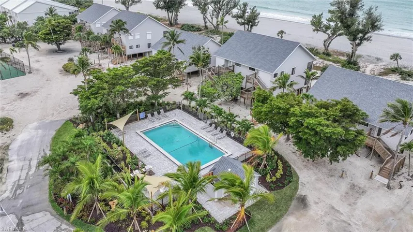 Bird's eye view of a pool area and unending shoreline