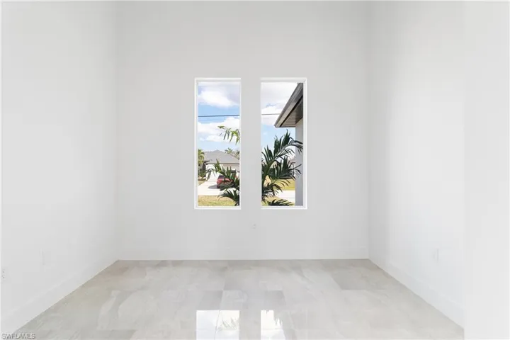 Empty room featuring baseboards
