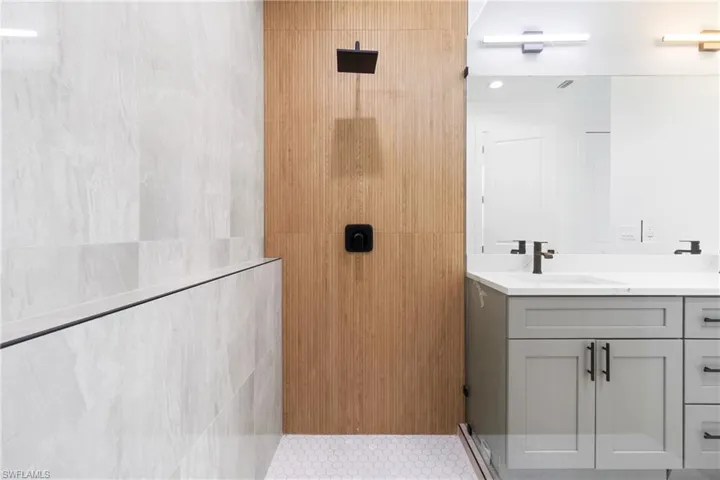 Bathroom with vanity and walk in shower