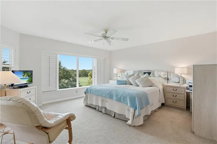 A tranquil primary suite overlooking the course - perfect for recharging after a day of Florida sunshine.