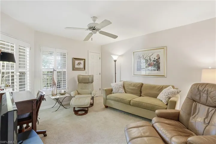 Comfortable den, ideal for a home office or extra living space.