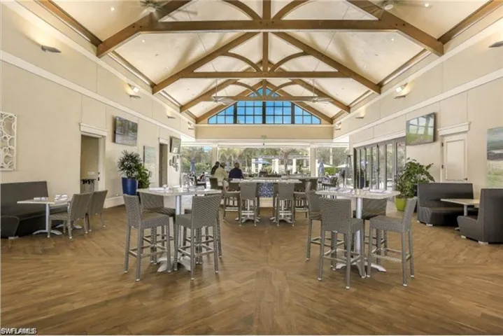 The Breezeway bar and restaurant overlooks a gorgeous resort style pool, also available for use with club membership.