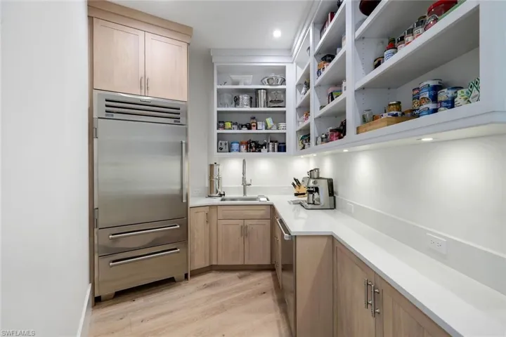 Butler pantry keeps the kitchen clean and loads of storage.
