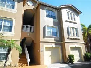 View of building exterior with an attached garage