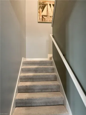 Stairway off of kitchen leading to guest bedrooms