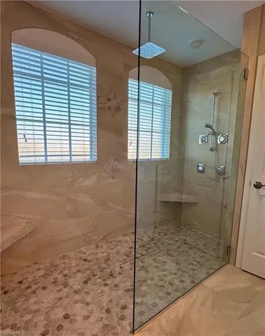 Shower lets in a lot of natural light and includes two seats